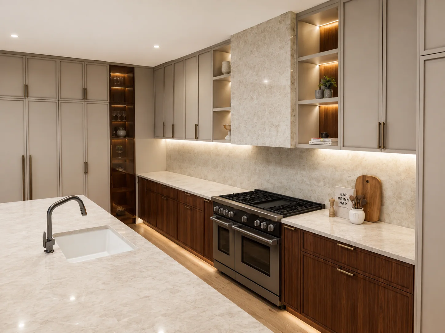 Wolf range beneath a natural stone hood with lit display niches